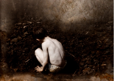 Boy collecting stones